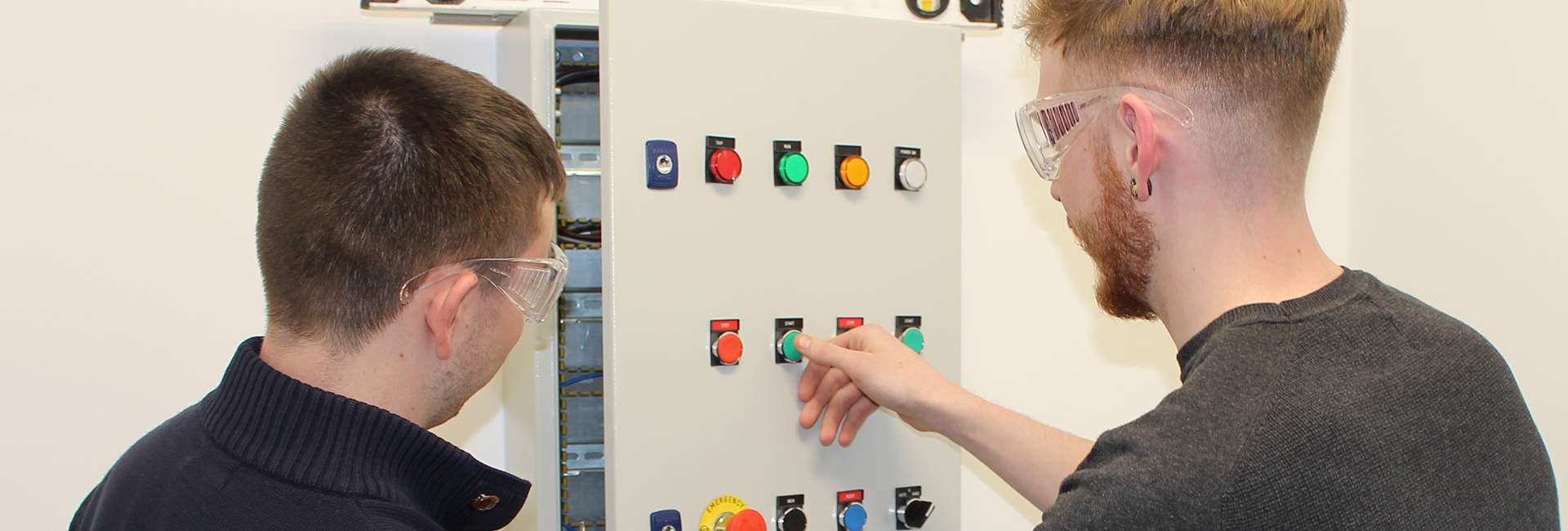 electrician working at a electrical board