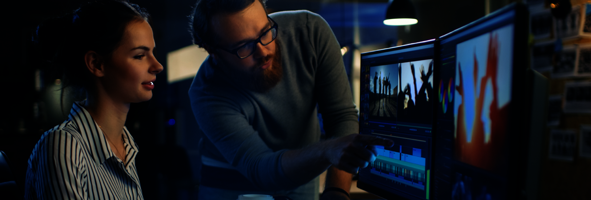 Digital Marketing Man and Woman working on a computer, Man is pointing at the screen
