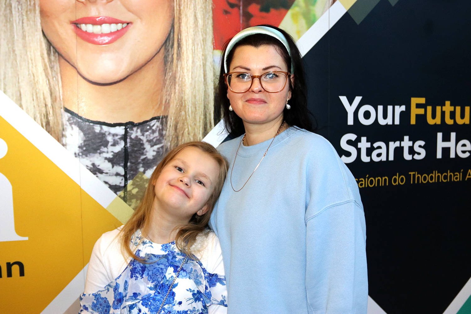 woman and child standing smiling