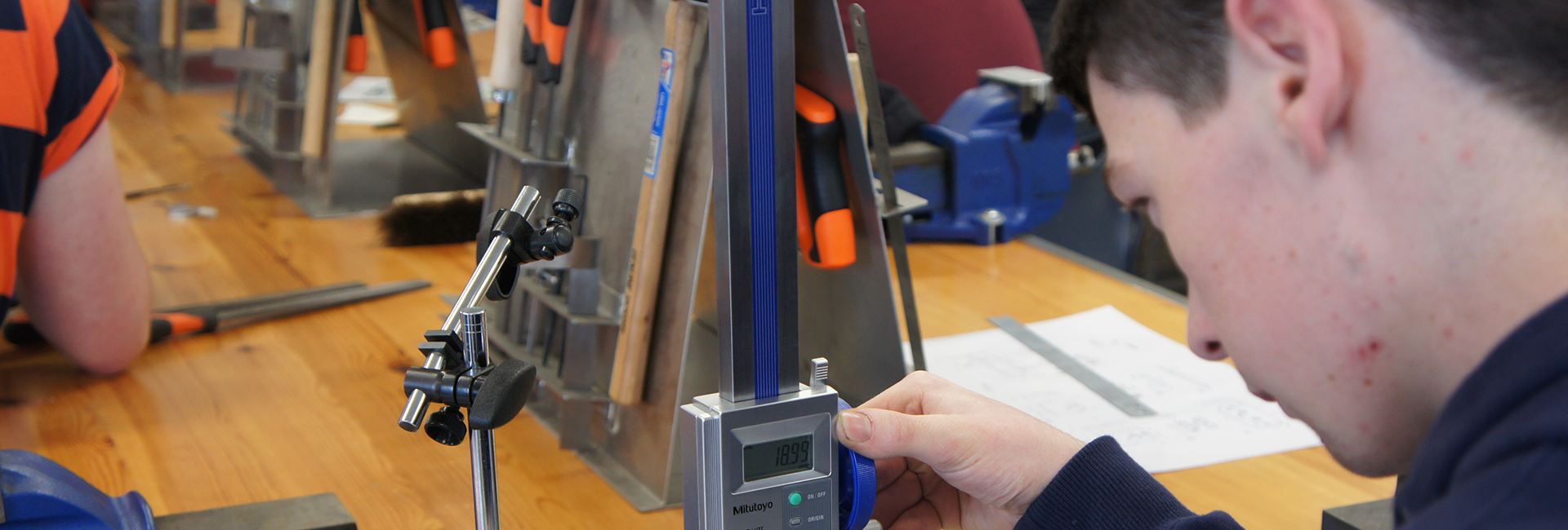 Man with a measuring machine